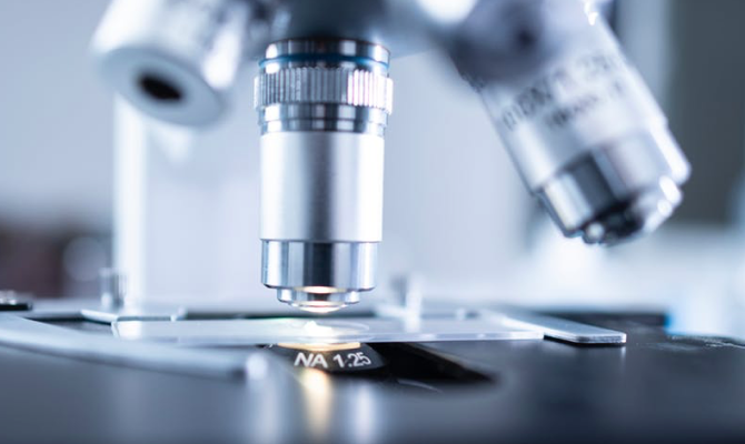 A microscope being used to examine algae